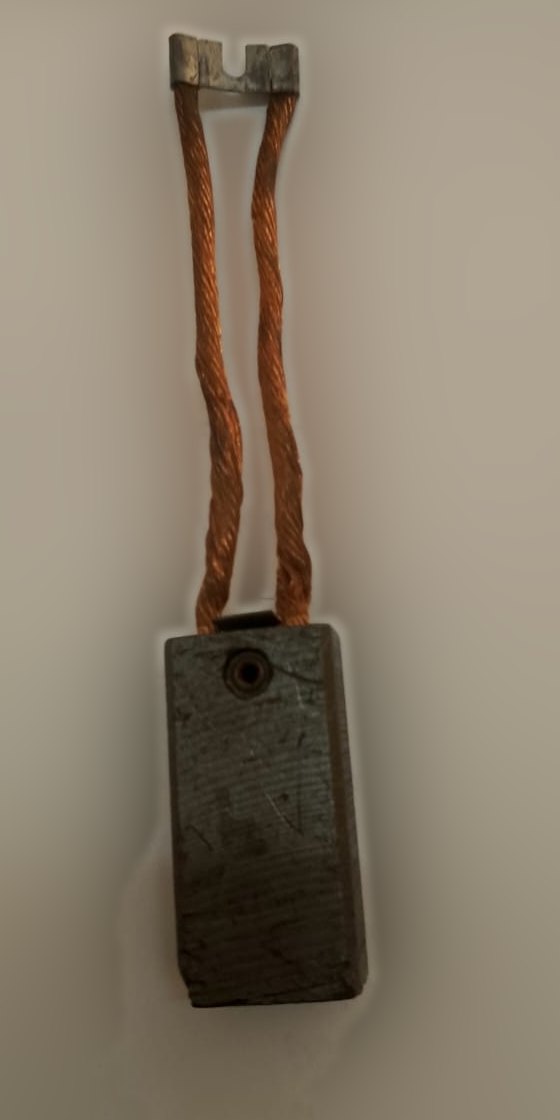 Electrographite carbon brush with twin tamped copper shunts and a forked terminal