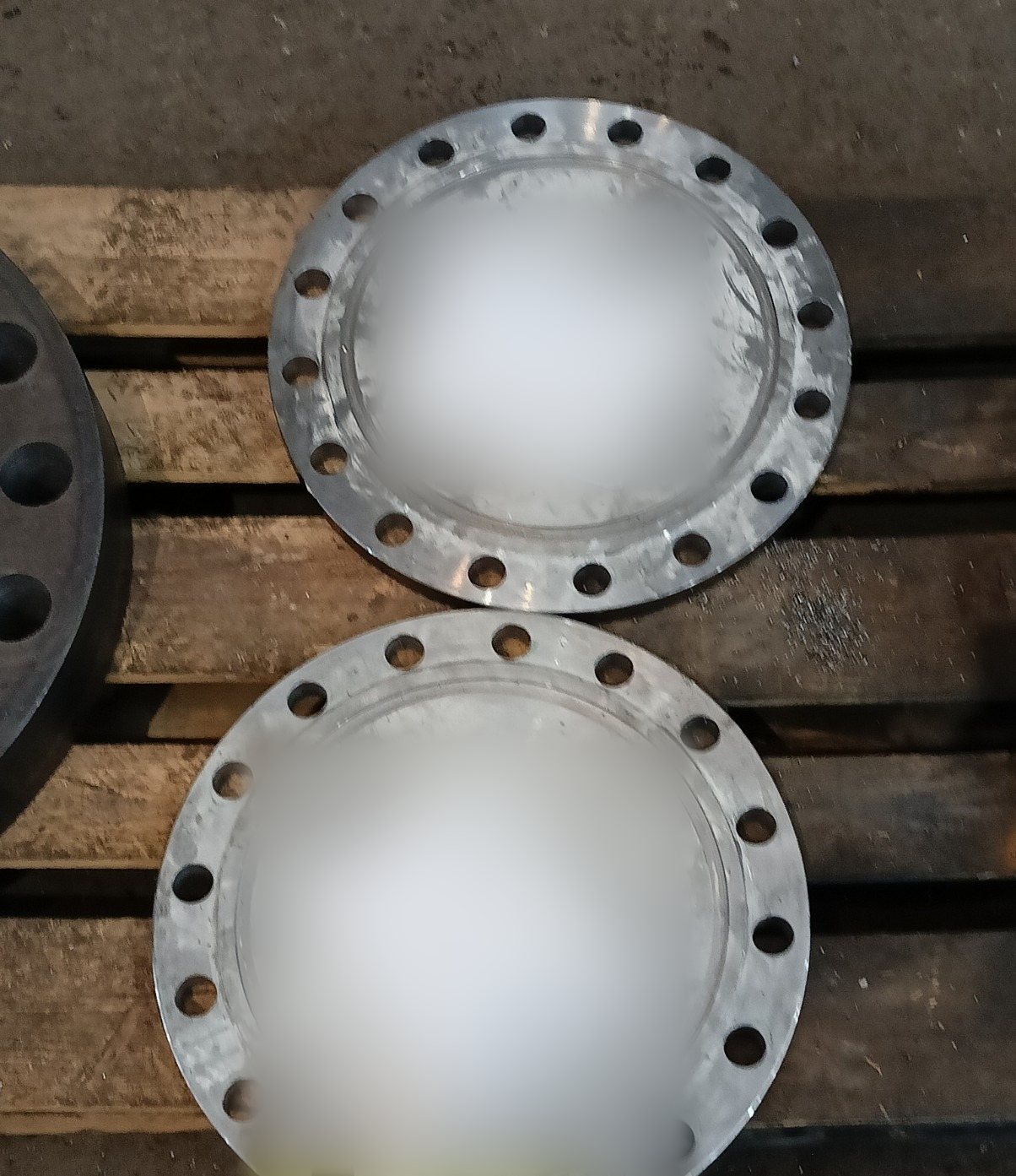 Two machined blind covers with raised-face sealing surfaces for a heat exchanger order